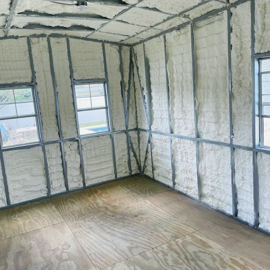 Closed-cell spray foam insulation applied to wall cavities in a residential project in Lavon